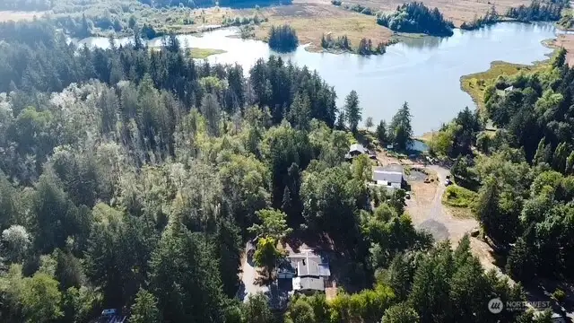 100 ft of Mudd Bay waterfront and private beach