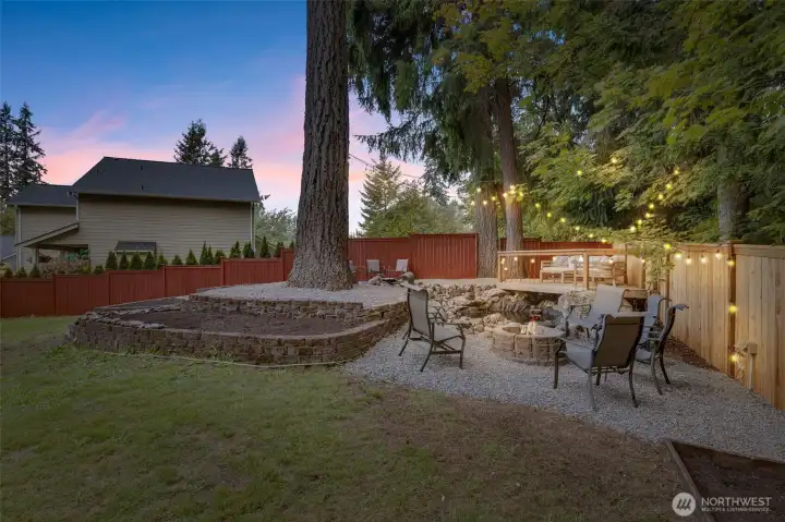 Twilight shot showing the vibe at dusk. Love this! Gather around the firepit and enjoy!