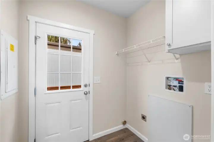 Functional laundry space with direct outdoor access.