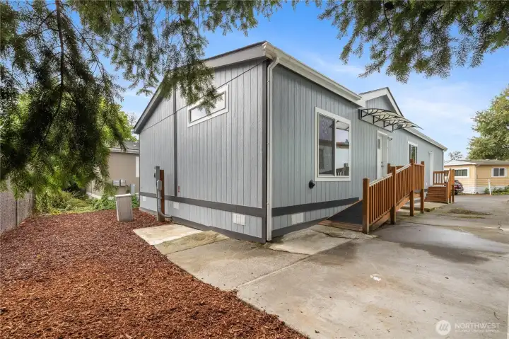Automatic fob-entry door with covered access for effortless arrival.