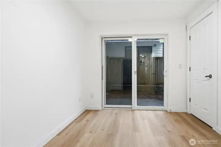 1st bedroom with access to backyard for relaxing.