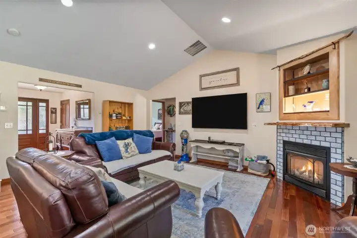 Vaulted ceilings and the tiled fireplace makes this a very comfortable room.