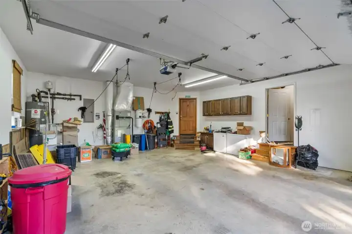 Garage incudes a large storage room to the right.