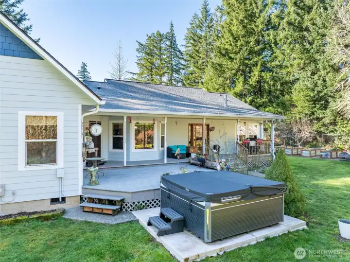 Large deck is partially covered with a blue pine ceiling.