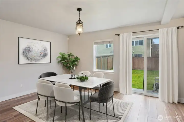 Dining area with views of the fully fenced backyard perfect for entertaining!