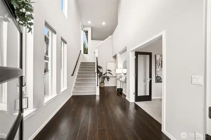 Large entryway with vaulted ceilings and remote controlled window shades