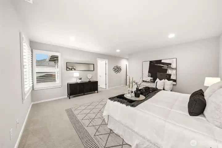 Primary bedroom and bathroom include custom shutters