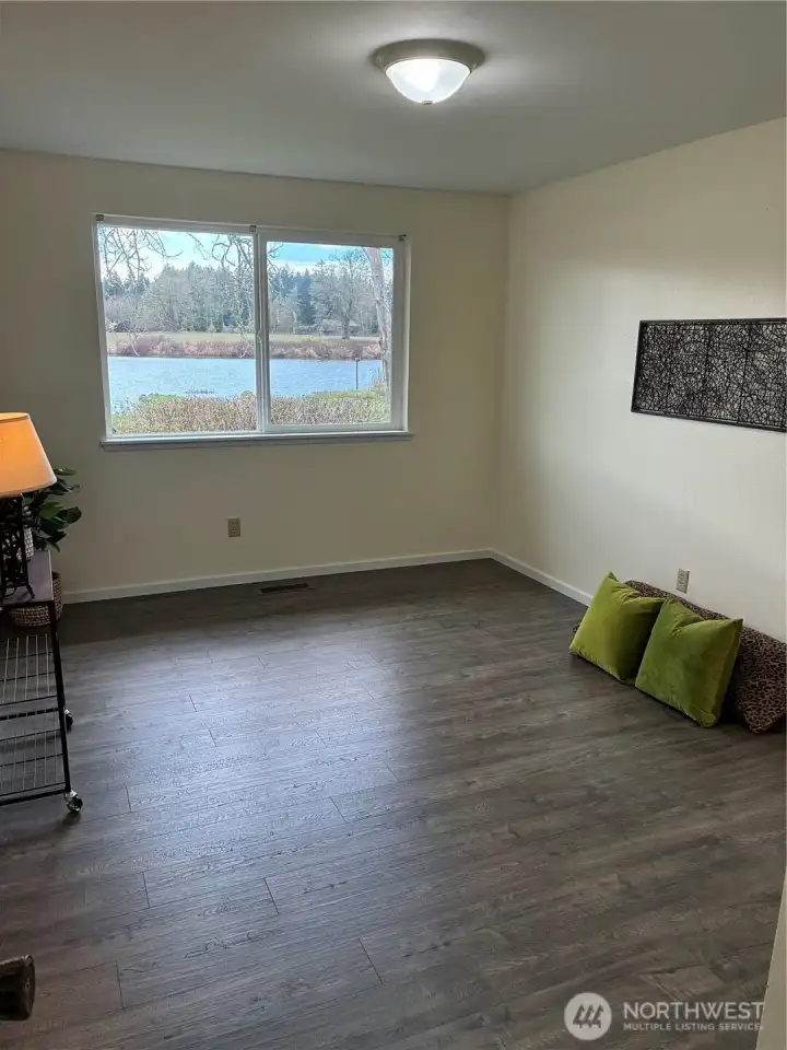 Primary bedroom suite enjoys lake views