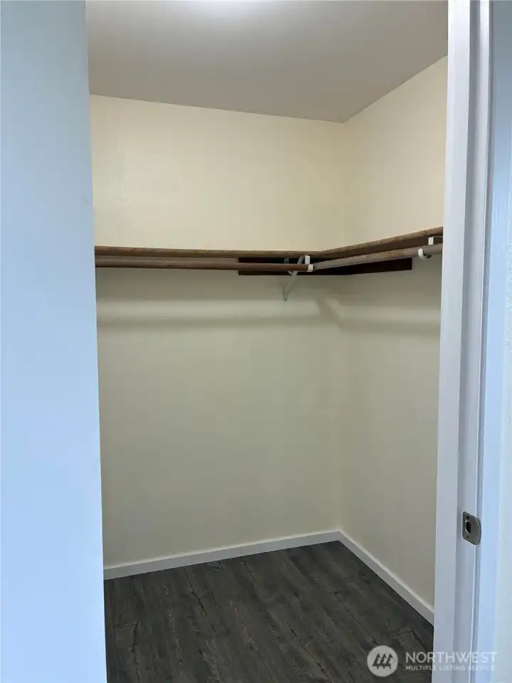 Primary bedroom walk-in closet