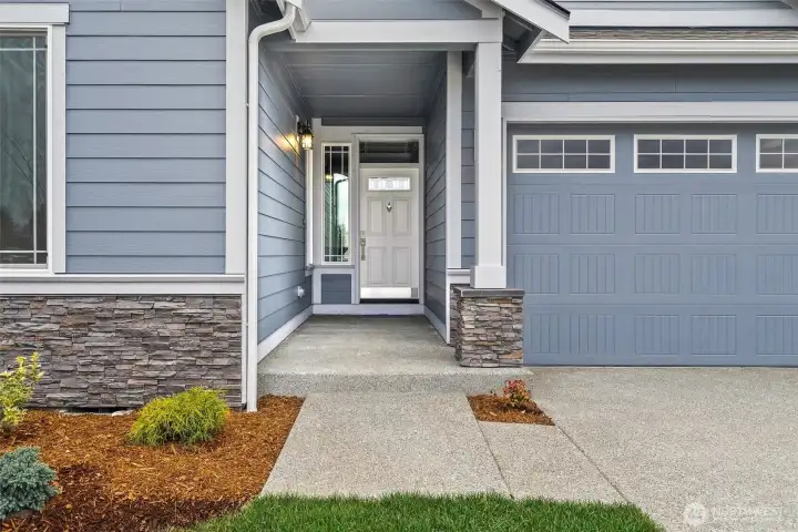 Nice covered front porch to greet guests at