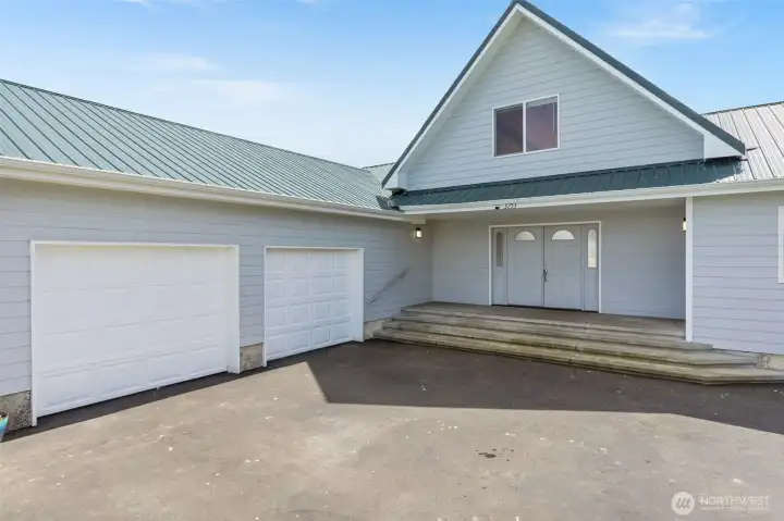 Front entrance with large double garage.
