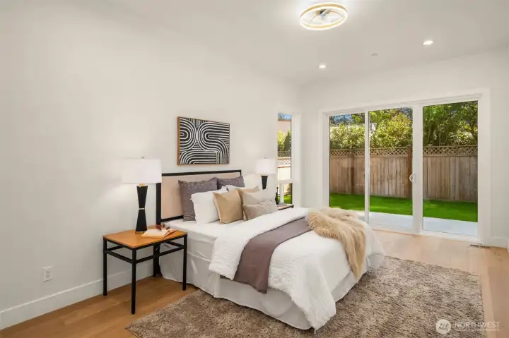 Extra spacious guest suite on Main with sliding door to peaceful backyard is perfect for guests!