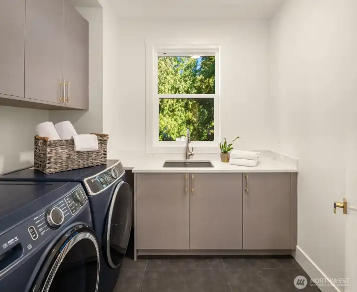 Laundry with utility sink and storage on 2nd floor.