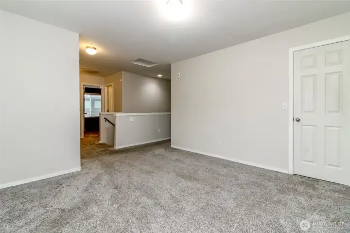 Living space upstairs with large walk in closet