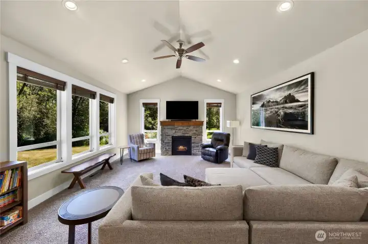 Great room with fireplace and lots of windows for all the natural light.