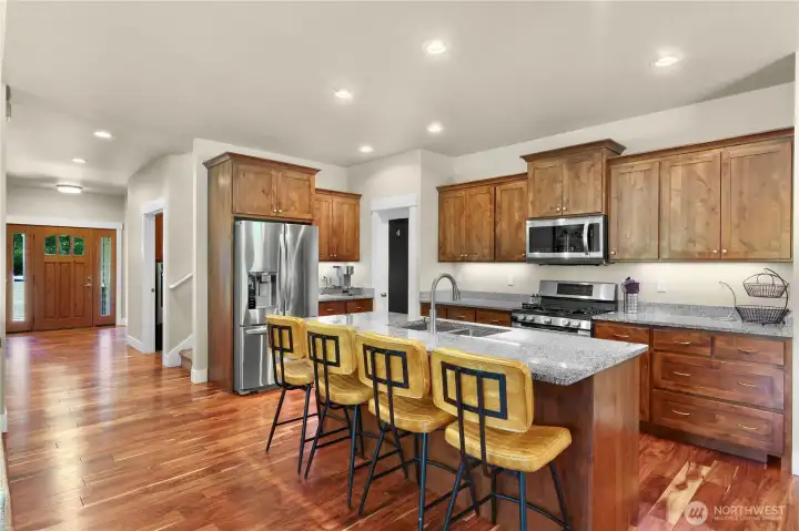 Eating bar, lots of cabinets, and walk in pantry.