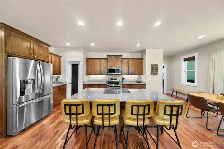 Kitchen view with eating bar makes for lots of place ot hang out and entertain.