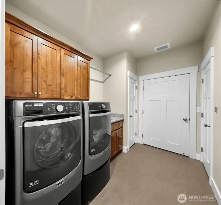 Utility room with cabinets and deep sink