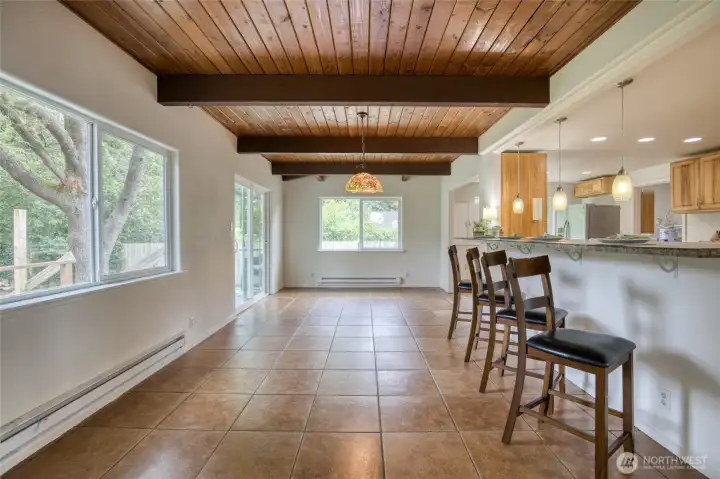 Large dining room with ceramic tile floors and breakfast bar can handle a crowd! Large dining room with ceramic tile floors and breakfast bar can handle a crowd!