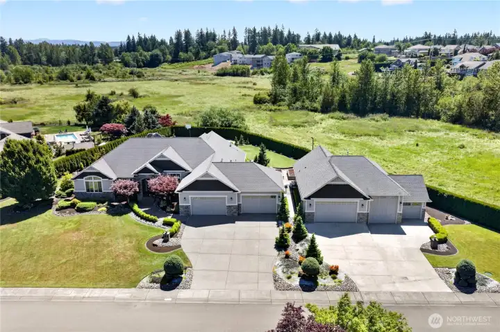 Sprawling rambler on private acre with MIL/Studio, resort style backyard w/pool and ultimate shop!