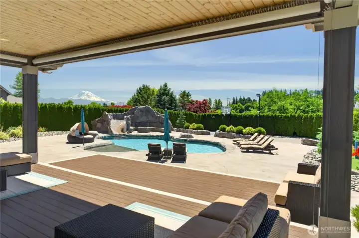 Covered back patio with drop down shades.