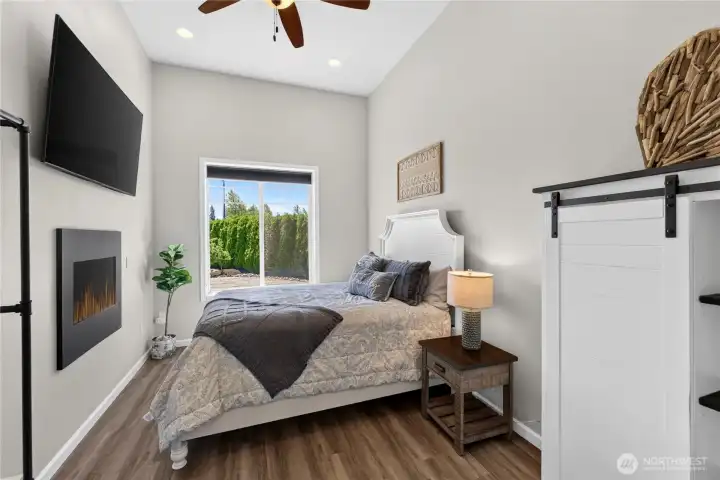 Studio/MIL sleeping area with double sided gas fireplace.