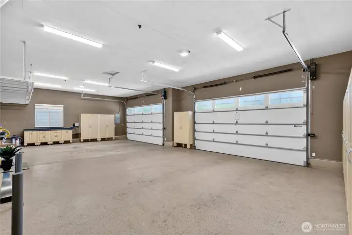 House finished & heated garage with Jackshaft motors. Both doors are 16x9.  Plus tons of storage space.