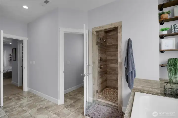 Start and end your day in a spacious ensuite featuring dual vanities, a soaking tub, and a beautifully tiled shower.