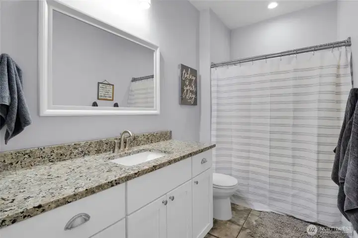 Clean lines, quality finishes, and a functional layout make this full bathroom both stylish and practical.