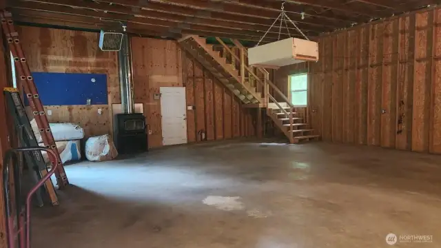 There's a woodstove for heating this space as needed for year round use.