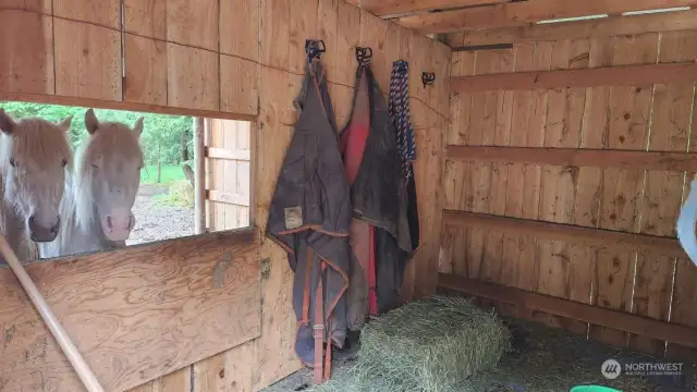 The stalls in the barn are both 12X16, there's also a heated tack room.