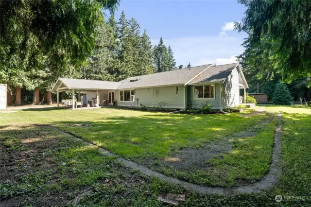 Huge Covered Patio for outdoor entertaining.  The home is packed with extras!