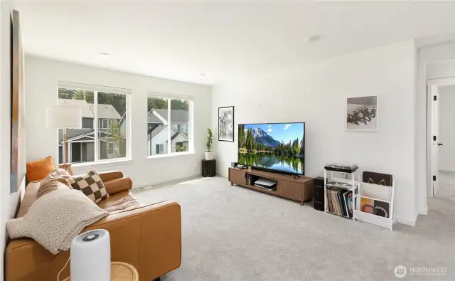 The top of the stairway loft is a place all it's own. Perfect for TV/gaming, or kids play area.