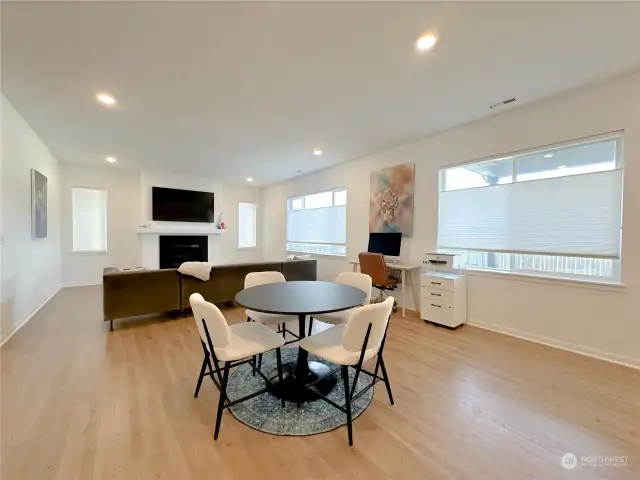 The living area part of the great room has a natural gas fireplace (not propane) and large window overlooking the backyard.