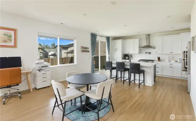 Kitchen, dining area, and slider leading to the back yard.