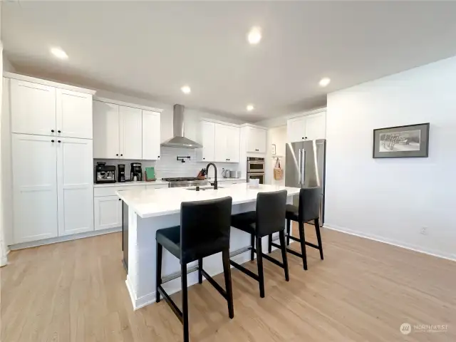 Another view of the kitchen. the doorway next to the refrigerator leads to the pantry, a mudroom area and then on to the two car garage.