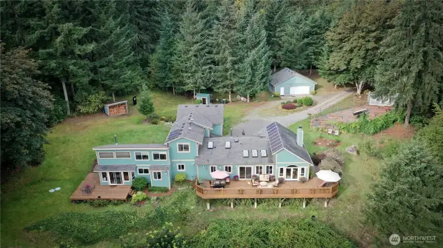 The view side of this sprawling NW Contemporary architecture faces East towards Mt Rainier.  Very private with no other homes in sight.  Also, no HOA.