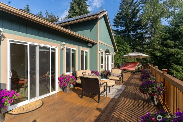 Huge cedar deck - great for entertaining and relaxing gatherings. Please note the outdoor sound system.
