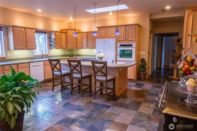 Beautifully laid out gourmet kitchen with center isle and bar stools as all guests tend to hang out with the chef as they prepare delicious meals  right in front of them.