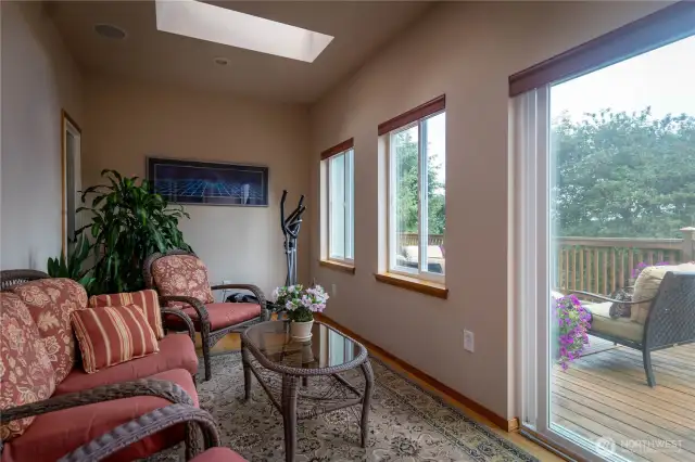 Very bright & happy garden room on main floor with built-in speakers, skylights & sliding door to the expansive deck. Would also be a great meditation room or a place to grow plants.
