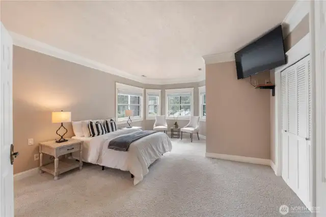Primary suite with beautiful views, 2 closets including 1 walk in closet, sitting area and attached updated bath