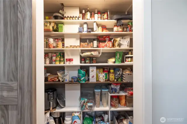 There is a newly added walk-in pantry with barn door in the kitchen.