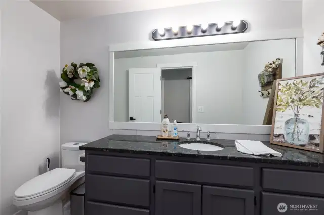 There is a large 1/2 bath on the main level.