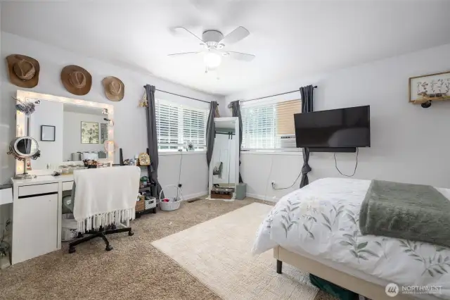 Upstairs bedroom #2 has lots of space and corner windows.