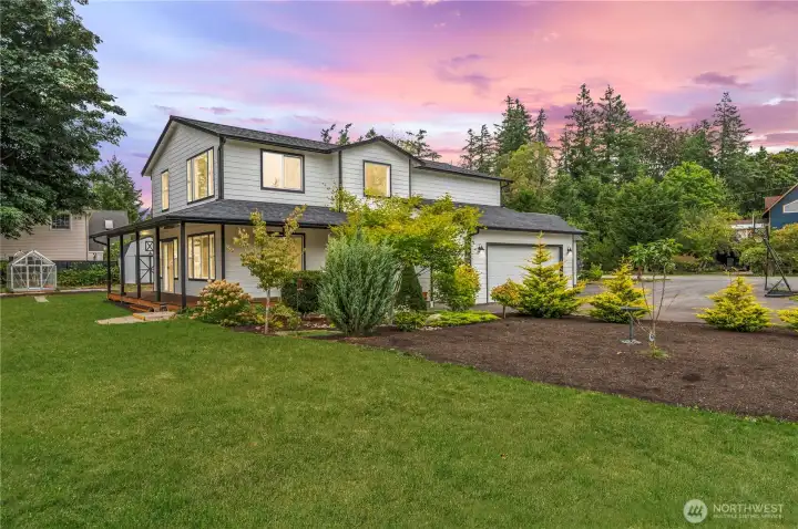 Stunning home with landscaped gardens and large driveway.