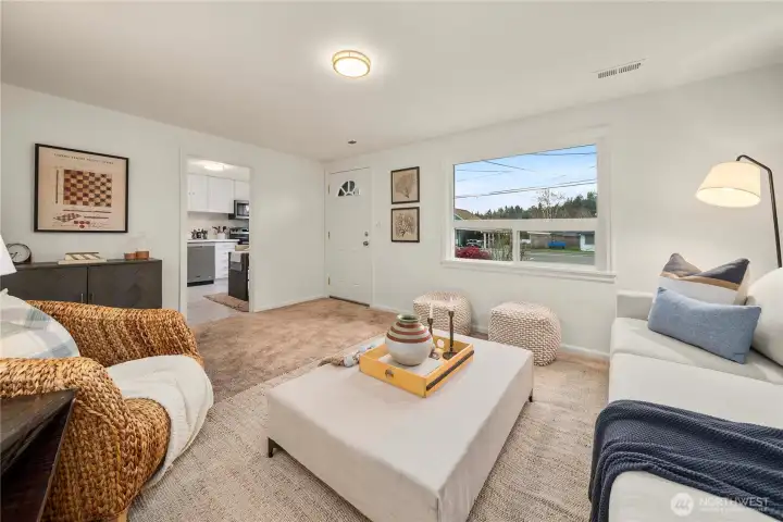 Directly adjacent to the living room is the kitchen with eating nook.