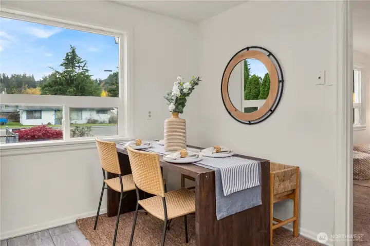 Eating nook in the kitchen has large window overlooking the front yard and lots of natural light.