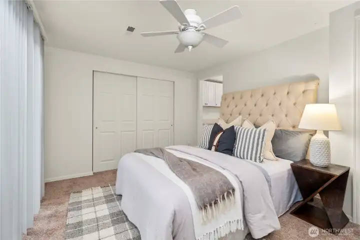 Large primary has its own bathroom and slider to backyard.