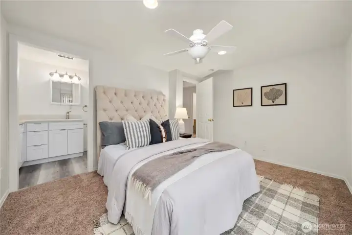 Primary suite features fully remodeled bathroom and updated fan/lighting.