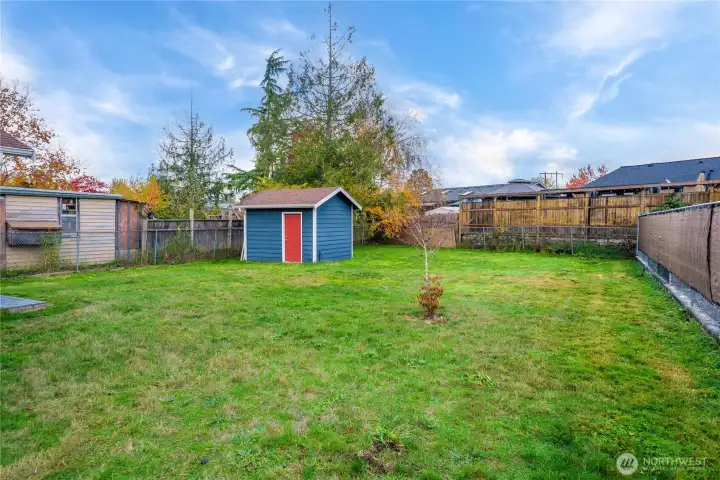 Newer shed conveys with home.
